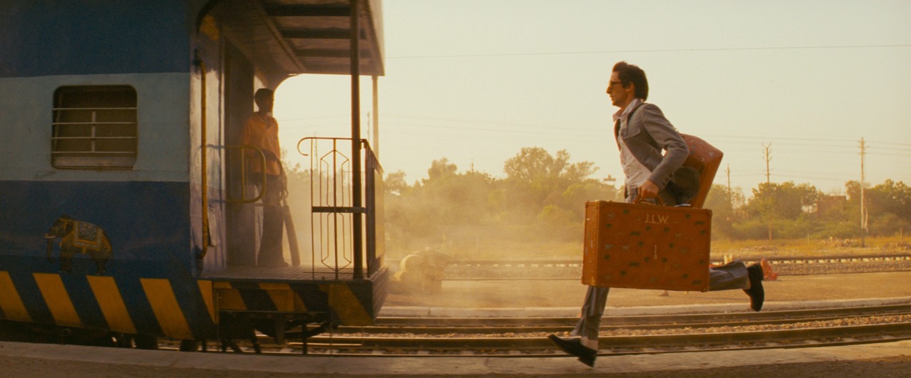 A man running to catch a train.