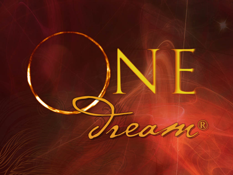A card that says "ONE Dream: The Transformative Journey" on it.