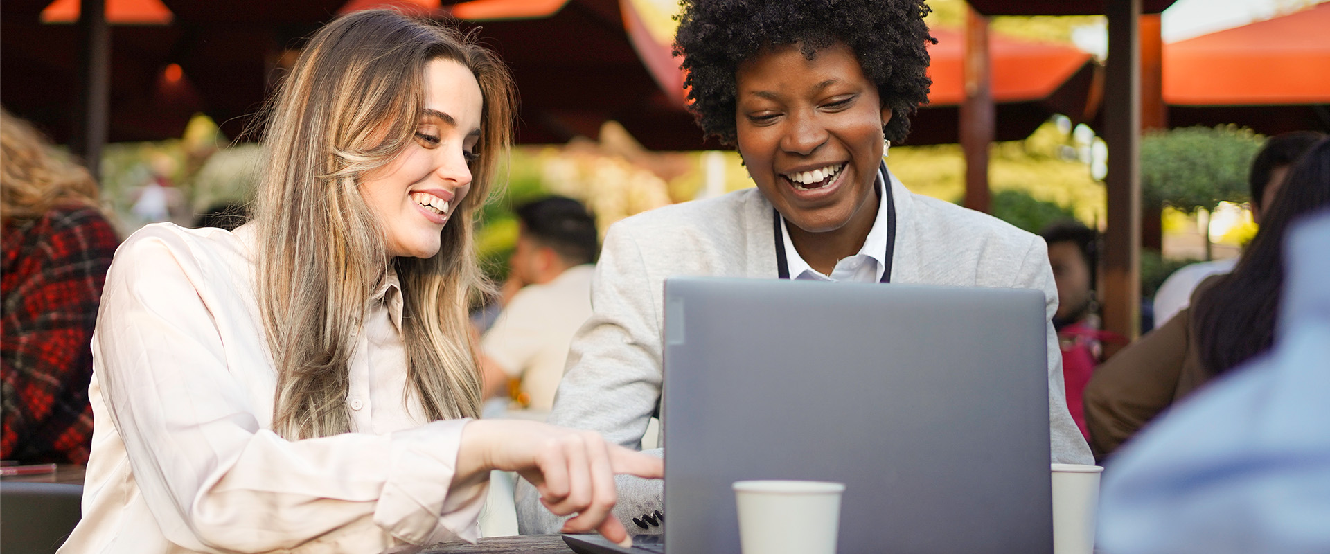Two colleagues looking at an online forum together.