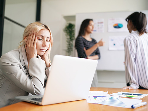 A corporate woman who is burnt out.