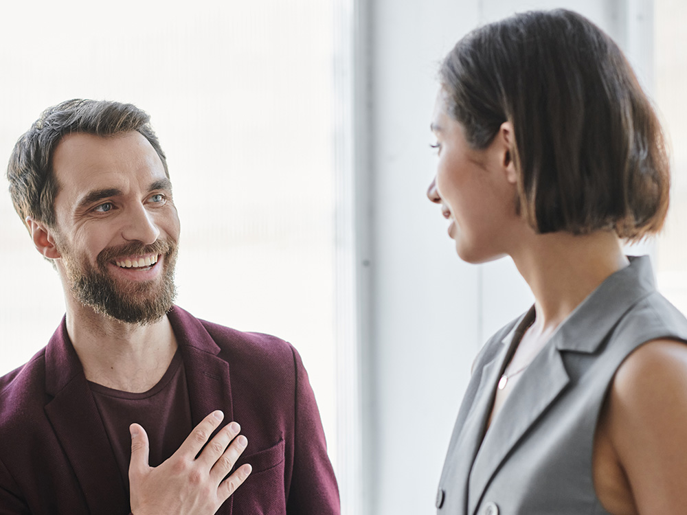 Two colleagues smiling together.